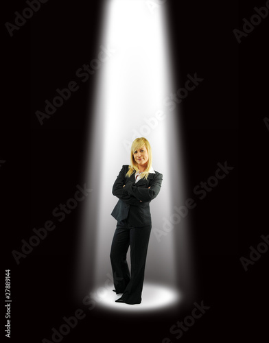 Foto: Business woman under spotlight Business woman under spotlight