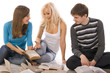 two beautiful girl and guy  reading a book,