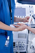 Technician using ultrasound treatment on patients wrist