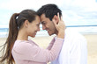 Foto: latin couple in love on the beach flirting latin couple in love on the beach flirting