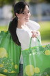 Casual woman with reusable shopping bags
