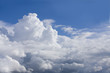 Puffy clouds in sunny, blue sky