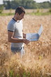 Photo: Man with laptop computer in wheat field Man with laptop computer in wheat field