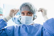 Surgeon wearing surgical mask in operating room