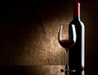 bottle with red wine and glass