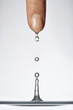 Water dripping from a woman's finger