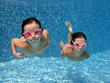 Two underwater girls in swimming pool