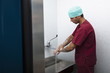 Surgeon scrubbing hands