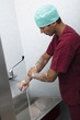 Surgeon scrubbing hands