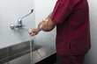 Surgeon scrubbing hands