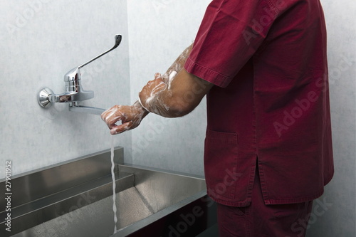 Photo: Surgeon scrubbing hands Surgeon scrubbing hands