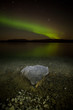 Northern lights mirrored on lake
