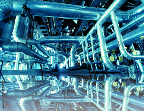 Photo: Industrial zone, Steel pipelines in blue tones with reflection Industrial zone, Steel pipelines in blue tones with reflection