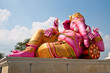 Pink ganesha statue in relaxing action Pink ganesha statue in relaxing action