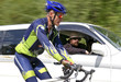 bicyclist overtakes a automobile