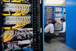 IT technicians checking network server
