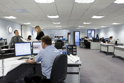 Foto: CAD designers and architects working in office CAD designers and architects working in office