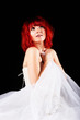 Pretty woman posing on a black background
