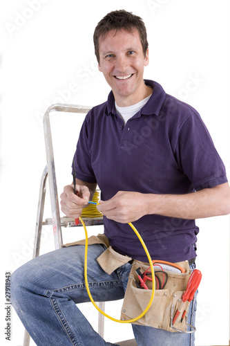 Photo: Smiling electrician working wire Smiling electrician working wire
