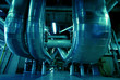 Equipment, cables and piping as found inside of a modern industr