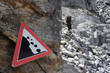 Hiker scrambles over rocks in the Swiss Alps Hiker scrambles over rocks in the Swiss Alps