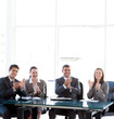 Cheerful businessteam applauding during a presentation