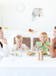 Parents and their children doing 	the benediction