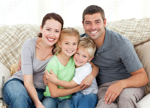 Photo: Happy family sitting on the sofa Happy family sitting on the sofa