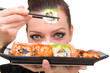 portrait of young woman with sushi..