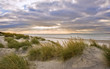 Stunning inspirational sunset image with glowing sun beams
