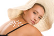 Woman with suntan lotion