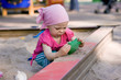 little girl in sandbox