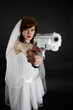 Serious bride take aim with a pistol Serious bride take aim with a pistol