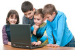 Four children studying using a laptop Four children studying using a laptop