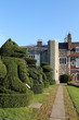 Topiary in gardens with tower at Hall Place, Kent