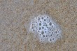 Schaum am Strand
