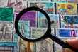 Stamp collection and magnifying glass