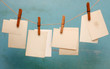 vintage photograph hang on the clothespin isolated on blue wall vintage photograph hang on the clothespin isolated on blue wall