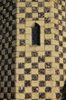 Chequered stone Tudor tower detail with lattice window Chequered stone Tudor tower detail with lattice window