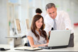 Foto: Manager and office worker in wheelchair Manager and office worker in wheelchair