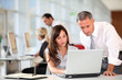 Foto: Manager and secretary working in the office Manager and secretary working in the office