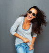 Windswept woman playing with shirt