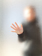 Foto: Silhouette of a girl through frosted glass Silhouette of a girl through frosted glass