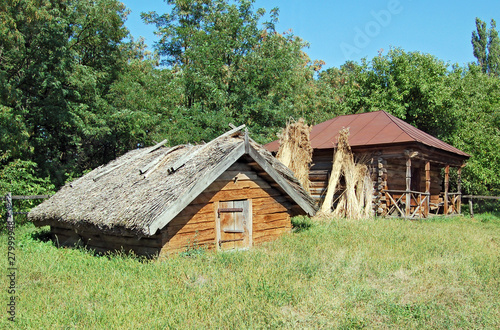 Photo: Ancient traditional ukrainian rural barn with a straw roof Ancient traditional ukrainian rural barn with a straw roof