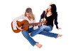 female guitarists tuning thier guitars