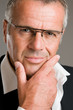 Pensive satisfied mature man
