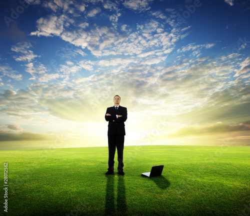 Photo: young businessman and sunset young businessman and sunset