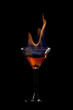 Flaming cocktail over black Flaming cocktail over black