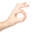 Photo: Female hand doing okay sign isolated on white background Female hand doing okay sign isolated on white background