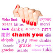 Hand holding card with the word "thank you" in many languages